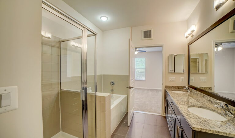 Bowen bathroom with double vanity, soaking tub and frameless shower